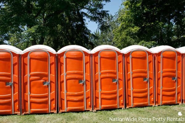 a lineup of clean and well-maintained portable loos for workers in Hillsboro, WI