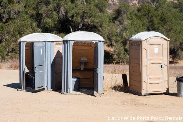 a clean row of portable restrooms for outdoor weddings or festivals in Athens, WI